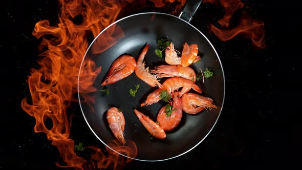 Super Slow Motion Shot of Throwing Prawns on Frying Pan and Fire Blast at 1000Fps