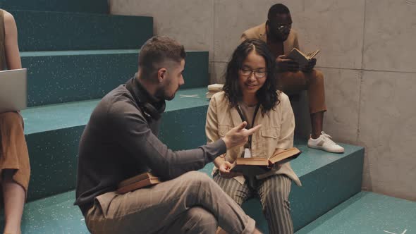 Multi-Ethnic Uni Students Studying Together on Stairs