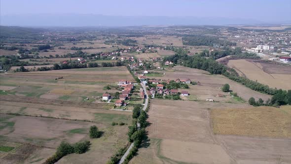 Farm land and small town in Kosovo seen from a distance