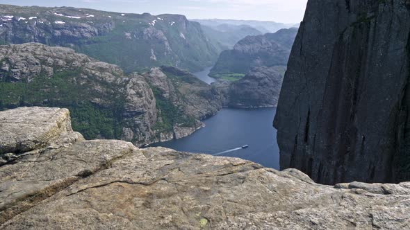 Preacher’s Chair Cliff, Aka Preikestolen, Norway. Major Tourist Destination. Precipice To Sea