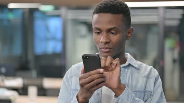 African Man using Smartphone