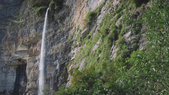 Waterfall falling from high cliff