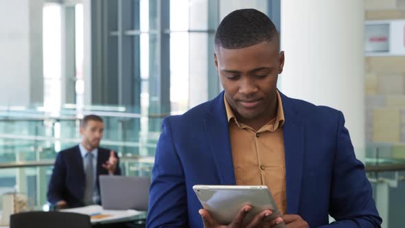 Young businessman using tablet in a modern office