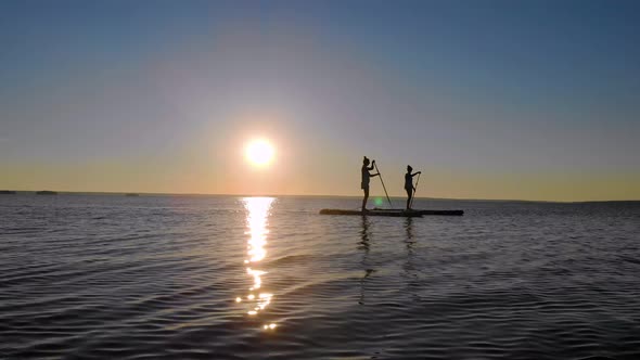 Women Walk on the Water on Sup Boards