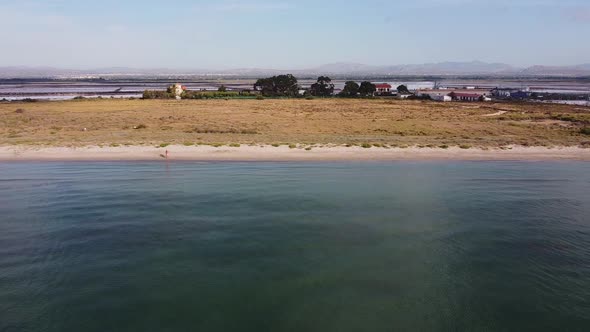 Flying along a beach and saltworks in Santa Pola, spanish Mediterranean