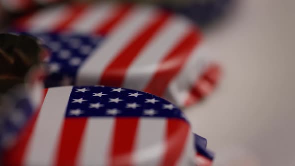 Rotating shot of bottle caps with the American flag printed on them - BOTTLE CAPS 046