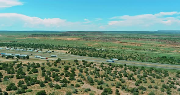 Horizontal Panorama Trucks Stop on Rest Area Near Interstate Highway in Desert Arizona