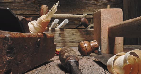 Old joinery workbench. Planes, tampers and chisels in carpentry workshop.