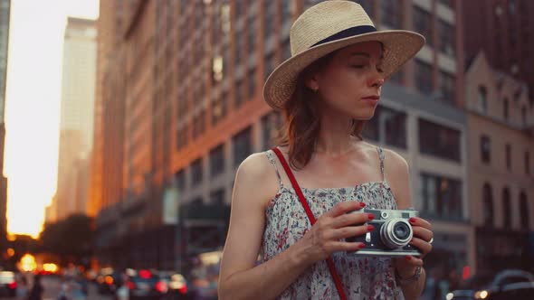 Young woman with a retro camera in Manhattan