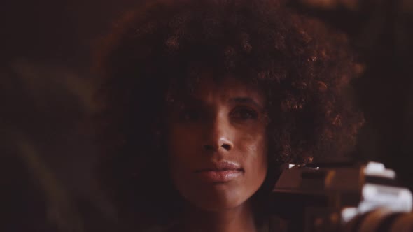 Woman With Afro Hair Filming With Vintage 8Mm Camera