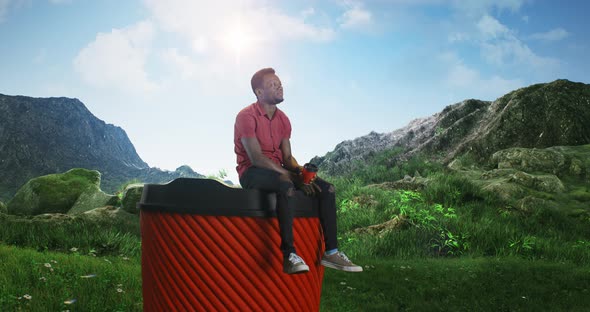 Black Man Drinking Coffee on Huge Cup in Nature