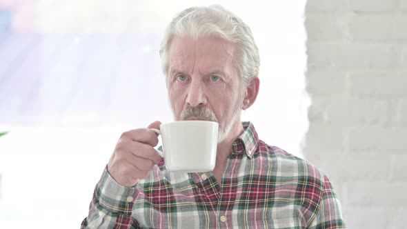 Portrait of Casual Old Man Drinking Coffee 