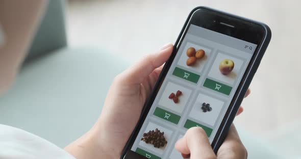 Ordering Food Vegetables and Fruits Online Using Smartphone App Close Up