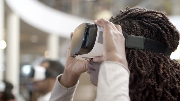 Young Woman Wearing Virtual Reality Glasses