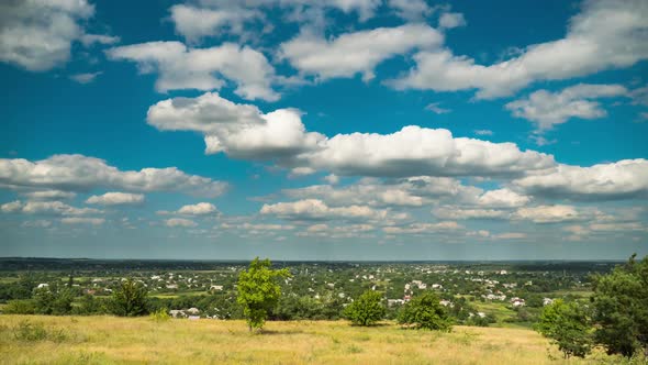 Landscape Fields and Moving Clouds in Blue Sky. Timelapse. Amazing Rural Valley. Ukraine