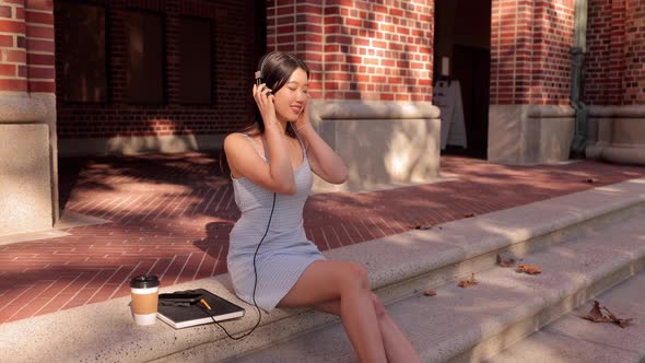 Asian female college student working on her homework