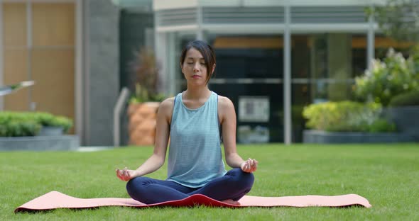 Woman do yoga at the park