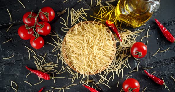 Pasta Dry Vermicelli with Tomatoes and Oil Slowly Rotating