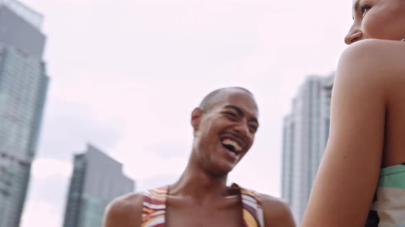 Fashion Models Dancing And Laughing Together In Bright Clothing