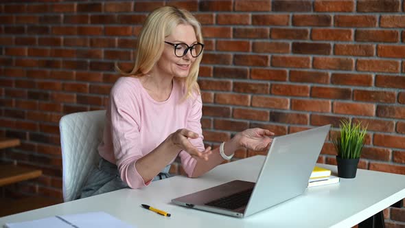 A Middleaged Woman in the Home Office