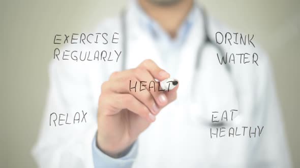 Health Care Concept, Doctor Writing on Transparent Screen