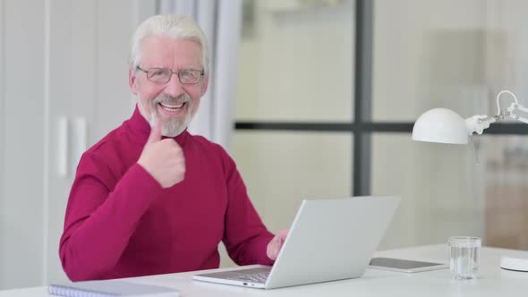 Thumbs Up By Old Man with Laptop at Work