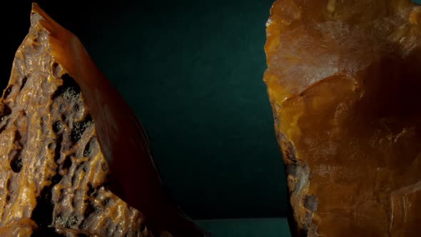 Large Yellow Amber Stone with Brown Dirt Reflects Light