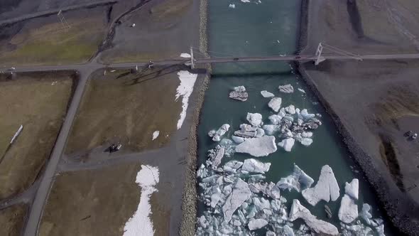 Aerial view of Jokulsarlon glacier lagoon with iceberg floating and mountains