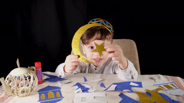 Boy Making Crescent and Star