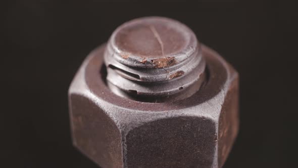 Bolt and Nut on a Revolving Table in Closeup