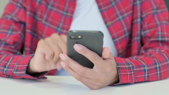 Hands of African Woman Using Smartphone