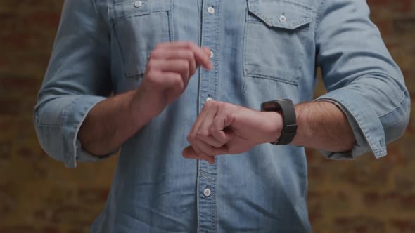 Man checking smartwatch