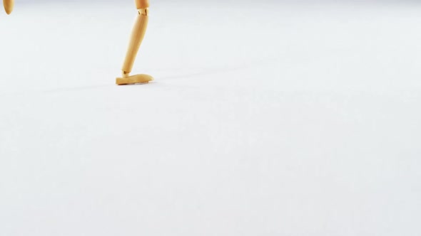 Figurine jogging on white background