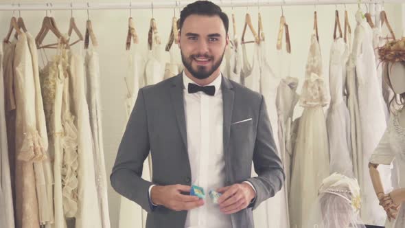 Groom Giving the Wedding Diamond Ring Towards Camera