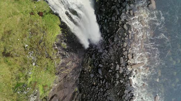 Top View of the Waterfall Near Neist Point and Rocky Shore in Scotland