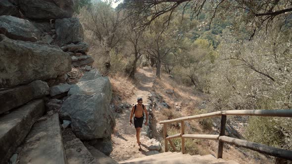 Man Walking In Forest.Man Walking In Ancient City.Man Exploring Old Town In Turkey.Ancient Town Amos