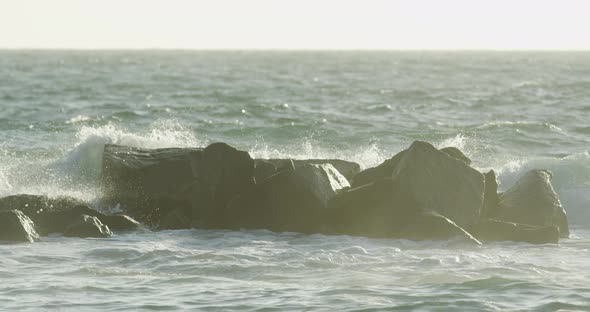 Waves crushing into rocks