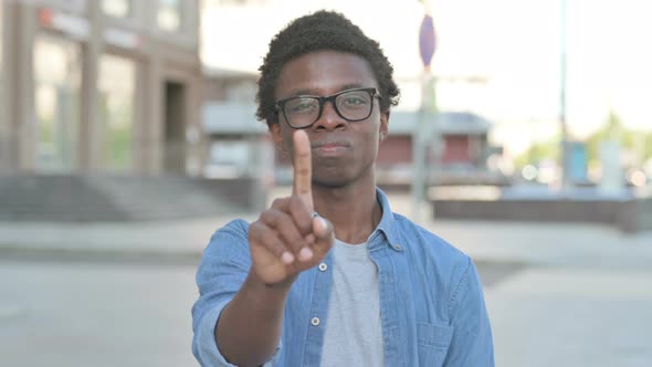 Rejecting Young African Man in Denial Standing Outdoor