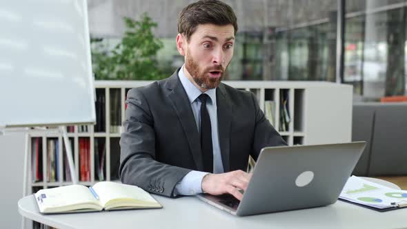 Joyful Happy Successful Adult Caucasian Business Leader Top Manager Stock Trader in Suit Sitting in