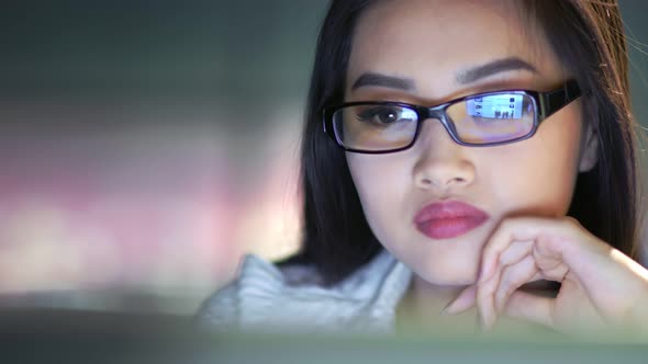 Closeup Asian Businesswoman Enjoying Online Shopping at Late Night Looking at Screen of Computer