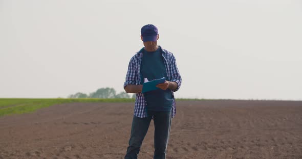 Agriculture Farmer Examining Field Modern Farming