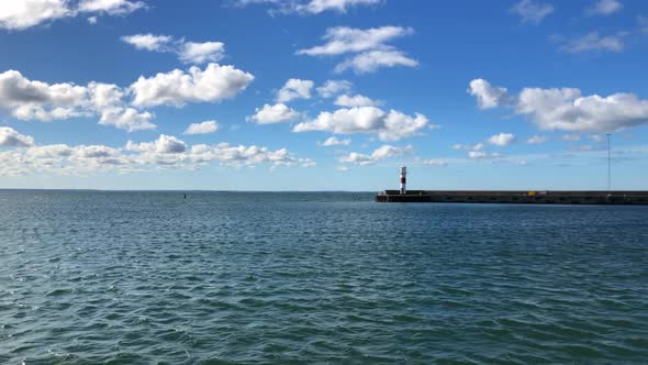 Light house in the far distance on a sunny day