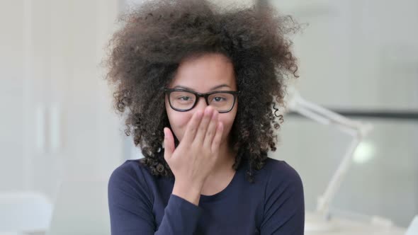 Portrait of African Woman Giving Flying Kiss