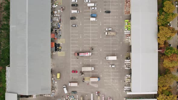Parking on Construction Shopping Center with Many Cars and Trucks Aerial View