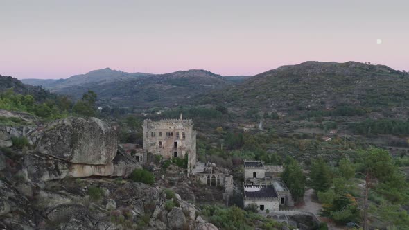 Drone aerial panorama of Termas Radium Hotel Serra da Pena at sunset in Sortelha, Portugal