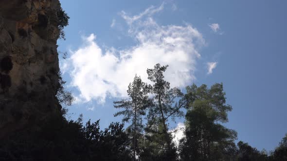 Clouds in Sunny Sky in Rocky Canyon