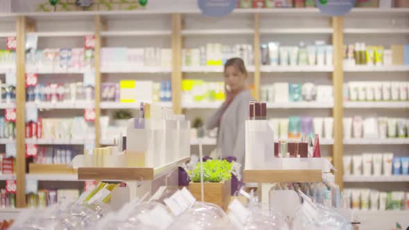 Beautiful Woman in Cosmetic Store