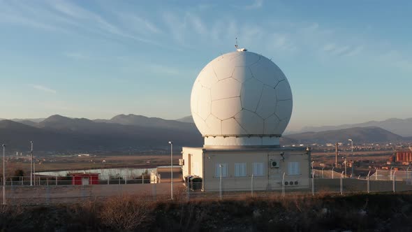 Giant radome sphere hiding radar antenna and surveillance equipment used by defense system. Dome