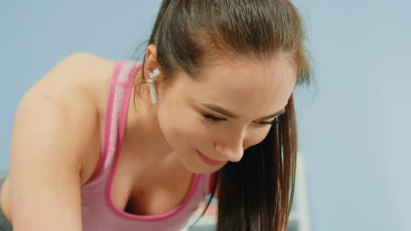 Satisfied Face of Woman Standing in Plank