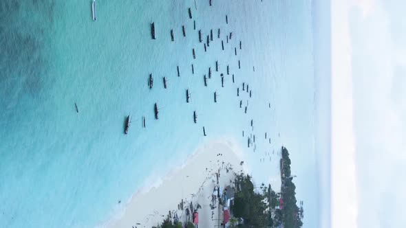 Vertical Video of the Ocean Near the Coast of Zanzibar Tanzania Aerial View